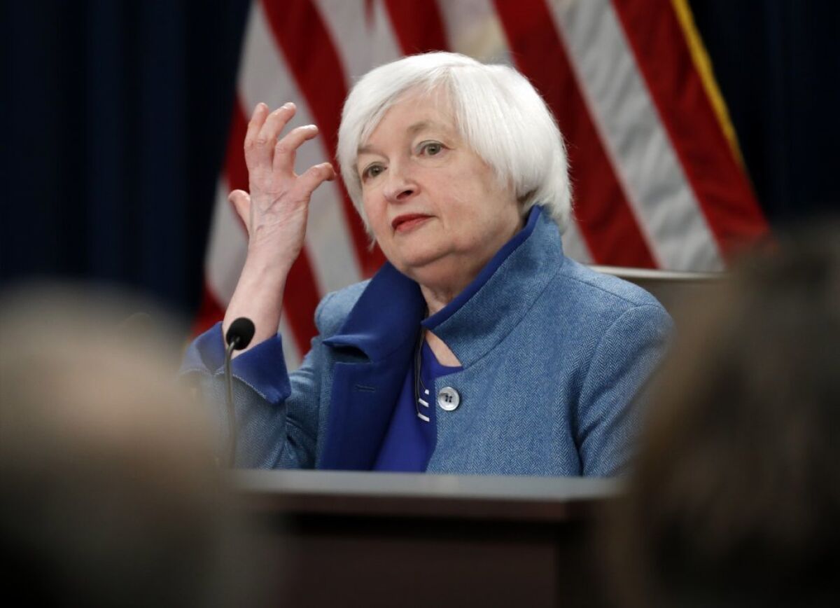 Federal Reserve Chair Janet Yellen listens to a reporter's question during a news conference in December.