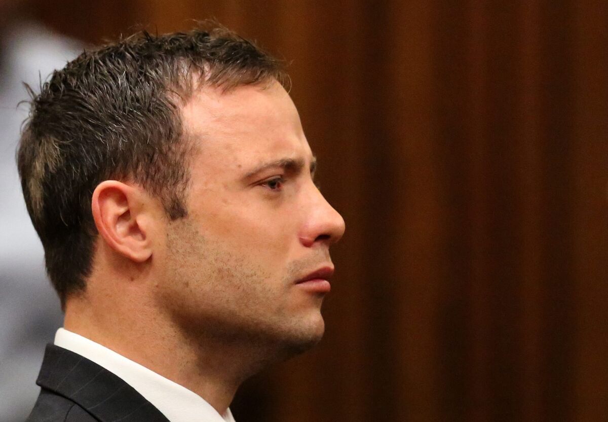 Oscar Pistorius, who was convicted of a negligent killing, listens to the verdict in Pretoria on Sept. 12.