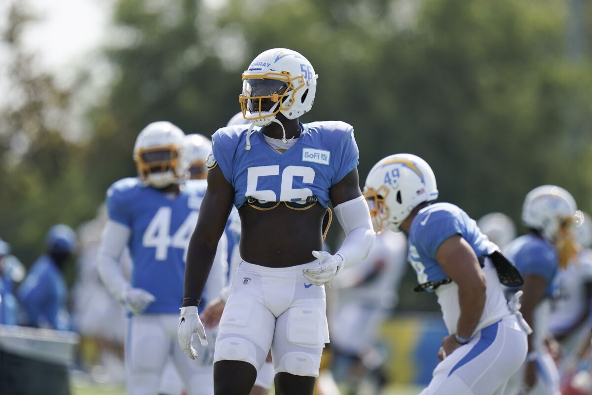 Chargers linebacker Kenneth Murray stands on the field.