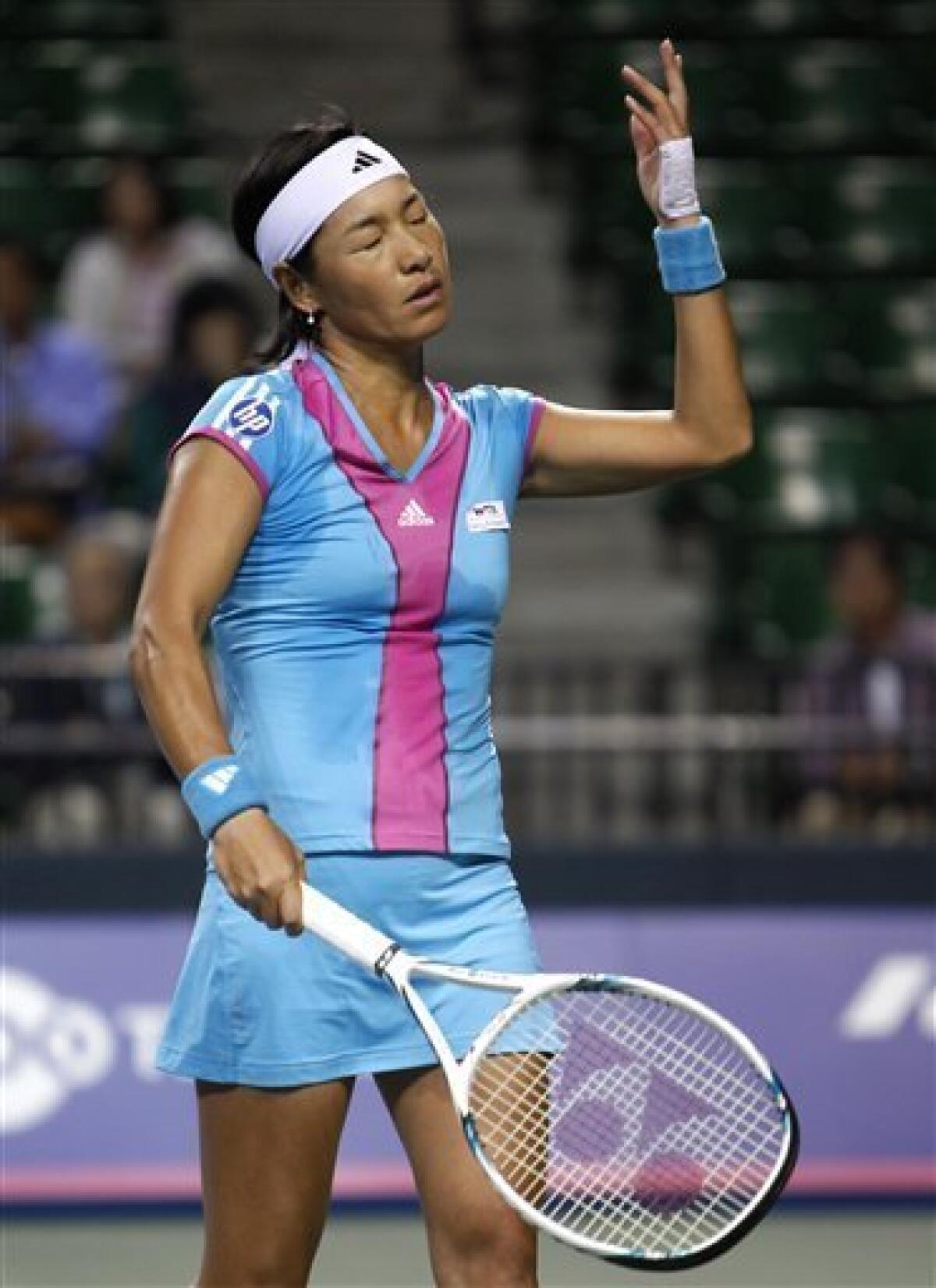 Kimiko Date-Krumm of Japan reacts to a lost point as she plays Mandy Minella of Luxembourg during the first round match of the Japan Pan Pacific Open tennis tournament in Tokyo, Monday, Sept. 26, 2011. Minella won 1-6, 6-3, 6-3. (AP Photo/Shizuo Kambayashi)