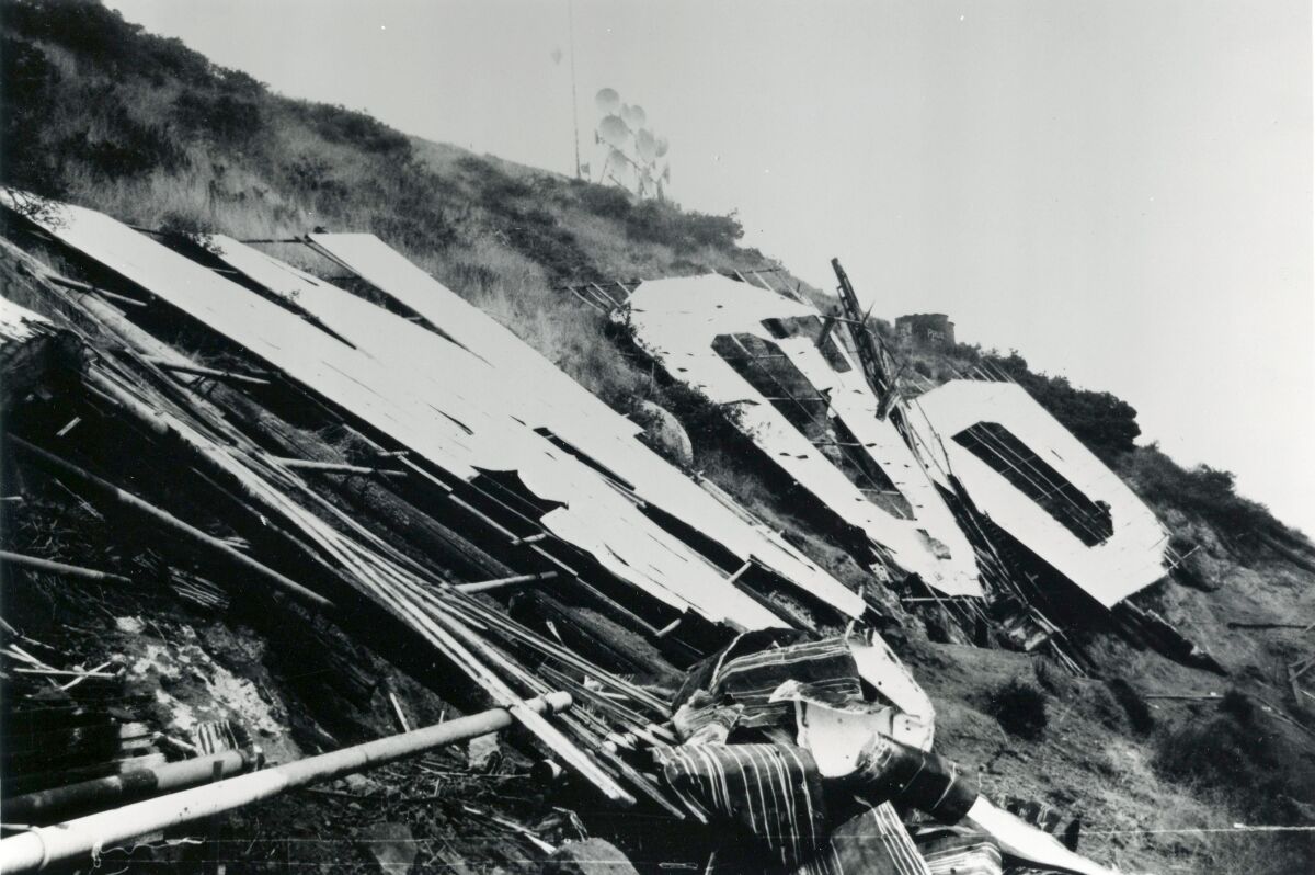 A 1978 photo of the Hollywood sign with the letters deteriorated and collapsed. 