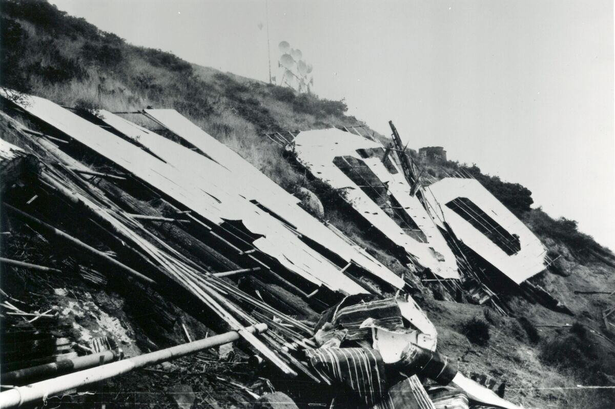 A 1978 photo of the Hollywood sign with the letters deteriorated and collapsed.