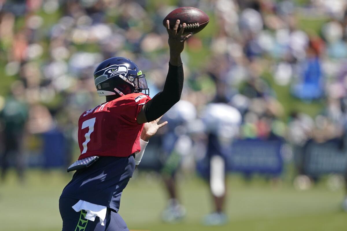 Seattle Seahawks quarterback Geno Smith passes during NFL football practice Wednesday, Aug. 3, 2022, in Renton, Wash. (AP Photo/Ted S. Warren)