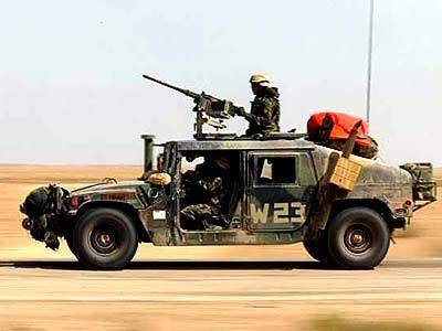 A humvee with a machine gun mounted on top