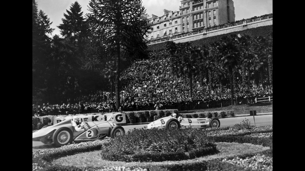 A Delahaye 145 (No. 2) driven by Rene Dreyfus trails a Mercedes-Benz (No. 6) driven by Rudolf Caracciola but went on to win the Grand Prix in Pau, France, on April 11, 1938.