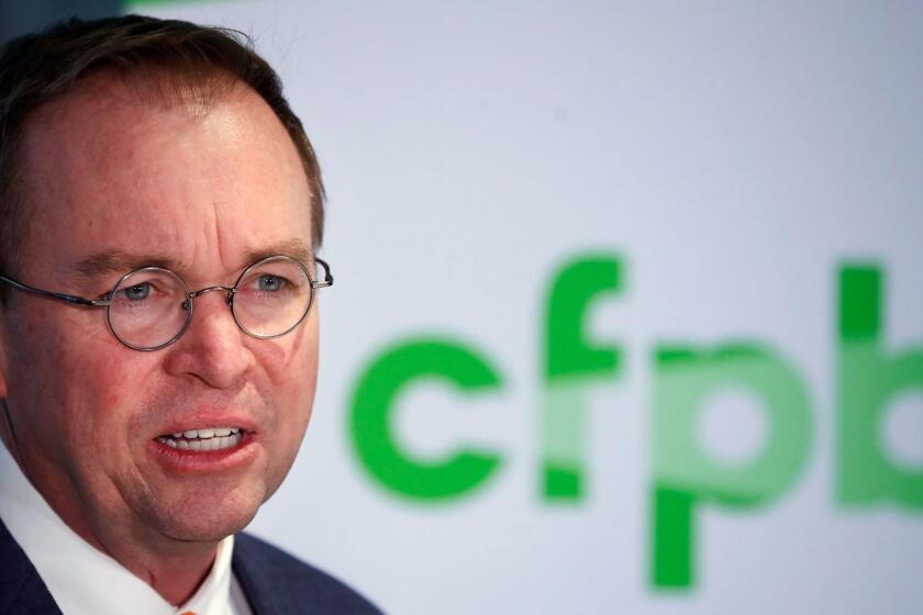 Mick Mulvaney speaks during a news conference after his first day as acting director of the Consumer Financial Protection Bureau in Washington, Monday, Nov. 27, 2017. (AP Photo/Jacquelyn Martin)