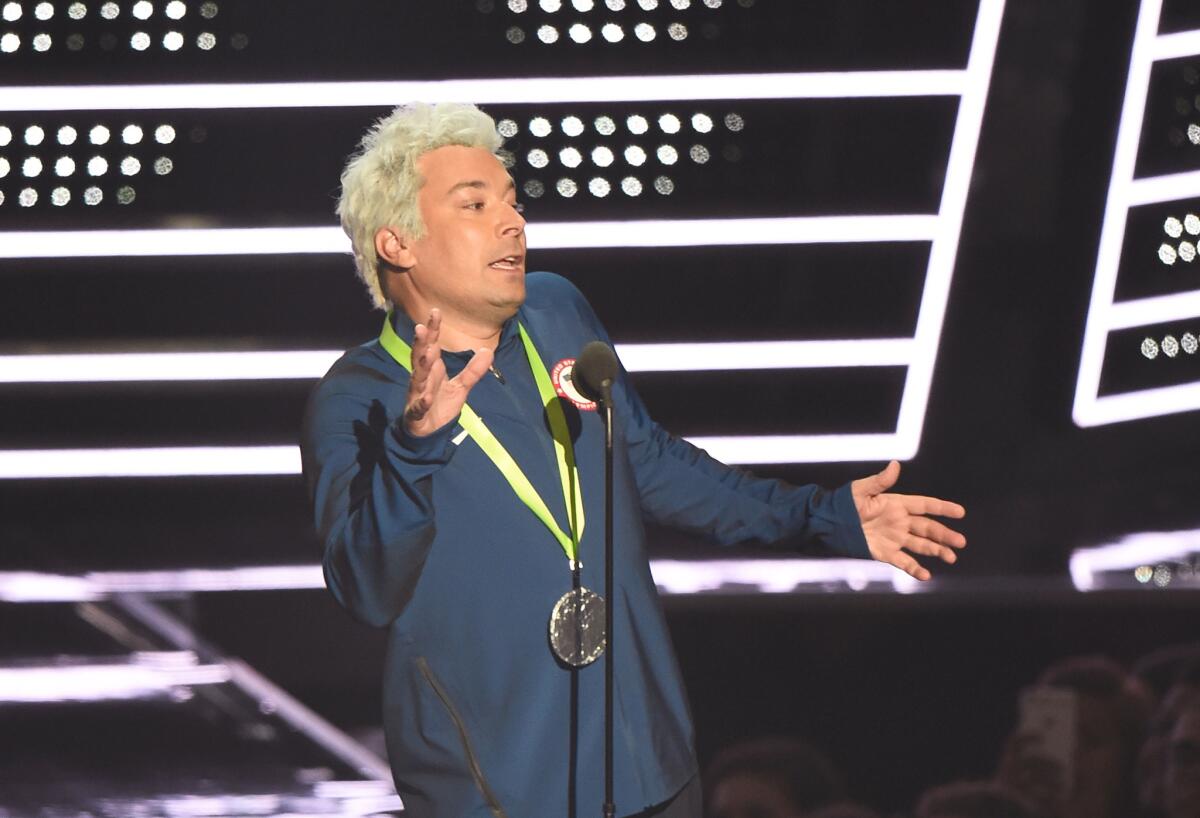 Jimmy Fallon as Ryan Lochte, announcing the nominees for video of the year.