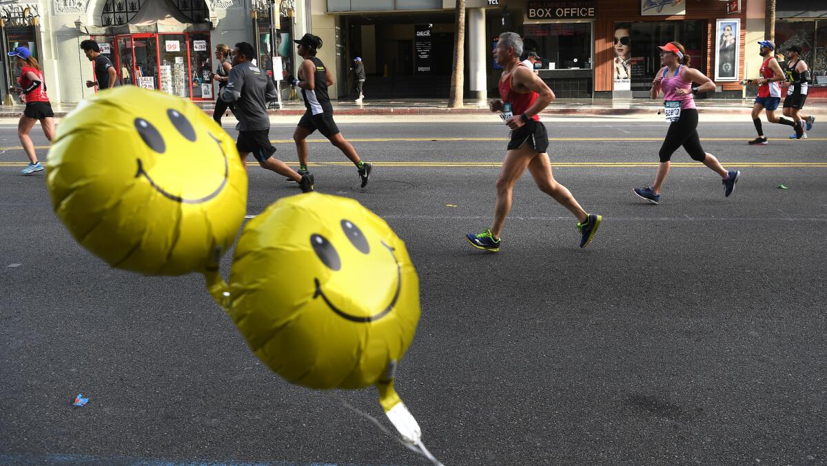 Competitors run along Hollywood Boulevard during the 2018 L.A. Marathon.