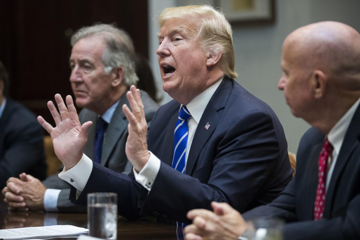 President Trump meets with members of the House Ways and Means Committee in Washington on Sept. 26.