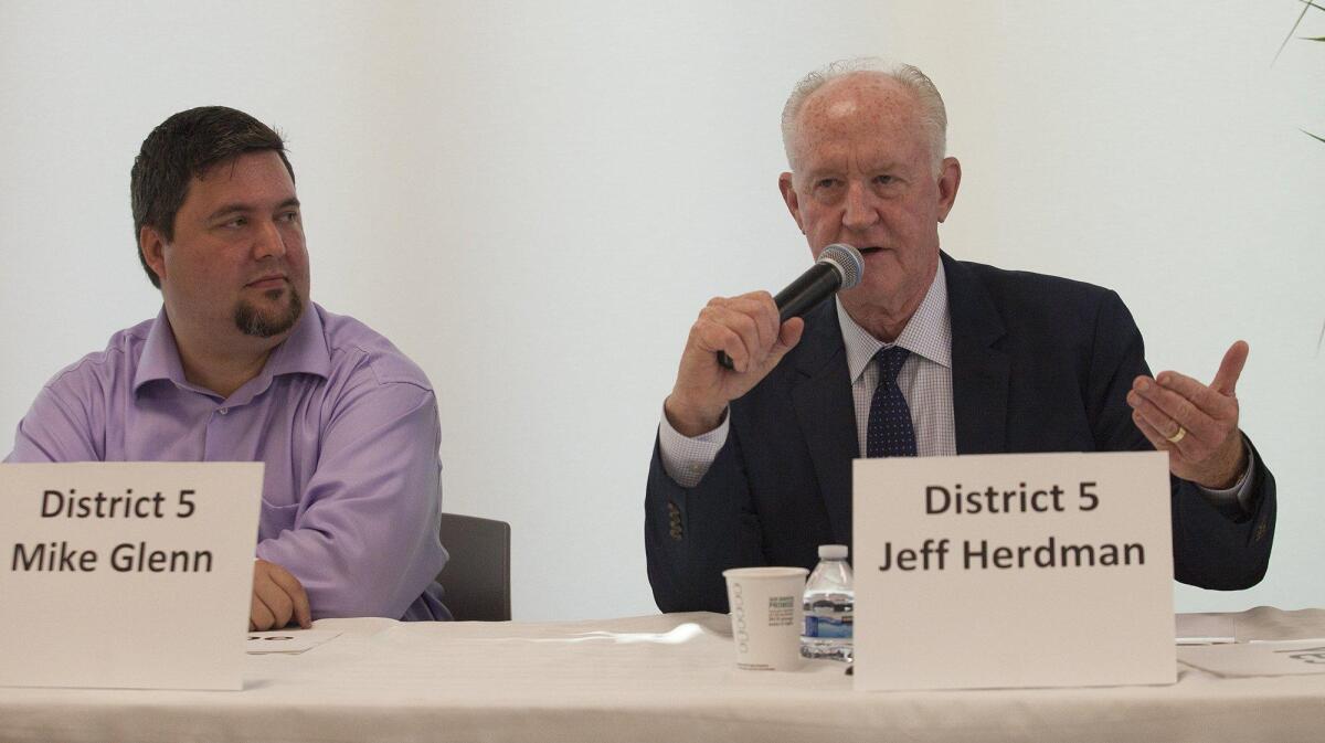 Newport Beach City Council District 5 candidates, from right, Jeff Herdman and Mike Glenn address questions during a West Newport Beach Assn. council candidate forum on Wednesday night at Marina Park in Newport Beach.