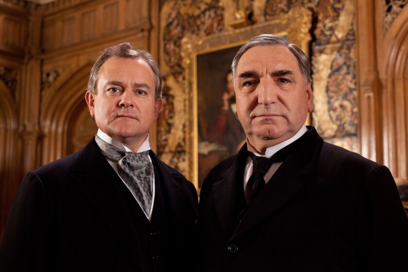 Hugh Bonneville as Lord Grantham, left, and Jim Carter as Mr. Carson from the series "Downton Abbey." The fourth season will debut Jan 5, 2014.