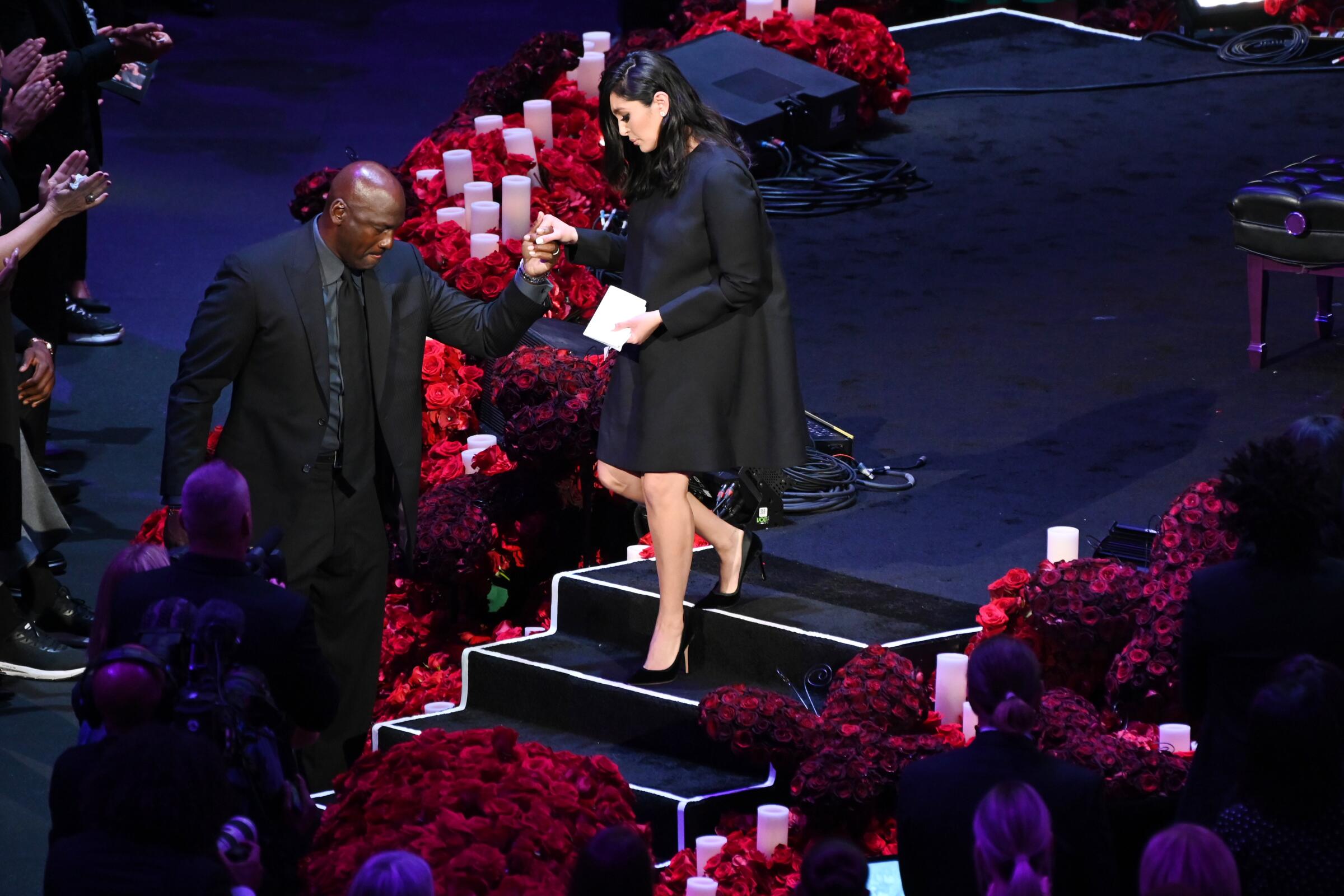 LOS ANGELES, CA., Michael Jordan helps Vanessa Bryant off the stage at the Kobe & Gianna Bryant Celebration of Life on Monday at Staples Center on Monday 24, 2020 (Wally Skalij / Los Angeles Times)