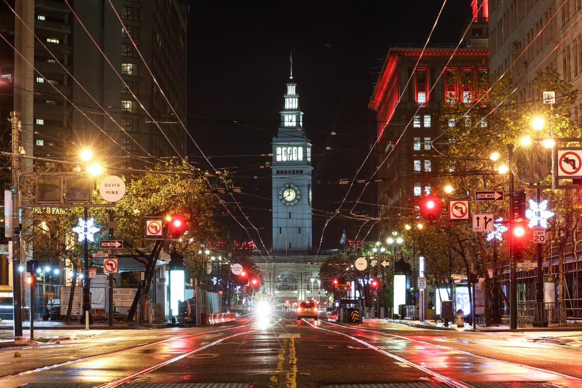 A night view of the Ferry Building and Market Street in San Francisco.