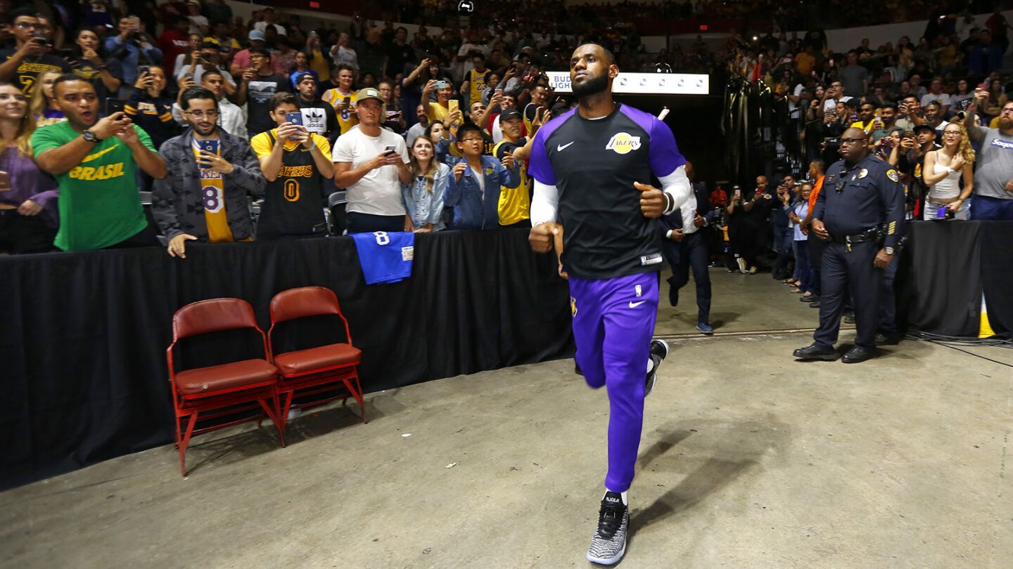 Los Angeles Lakers LeBron James runs out to the court for a game against the Denver Nuggets in San Diego on Sunday, September 30, 2018. (Photo by K.C. Alfred/San Diego Union-Tribune)