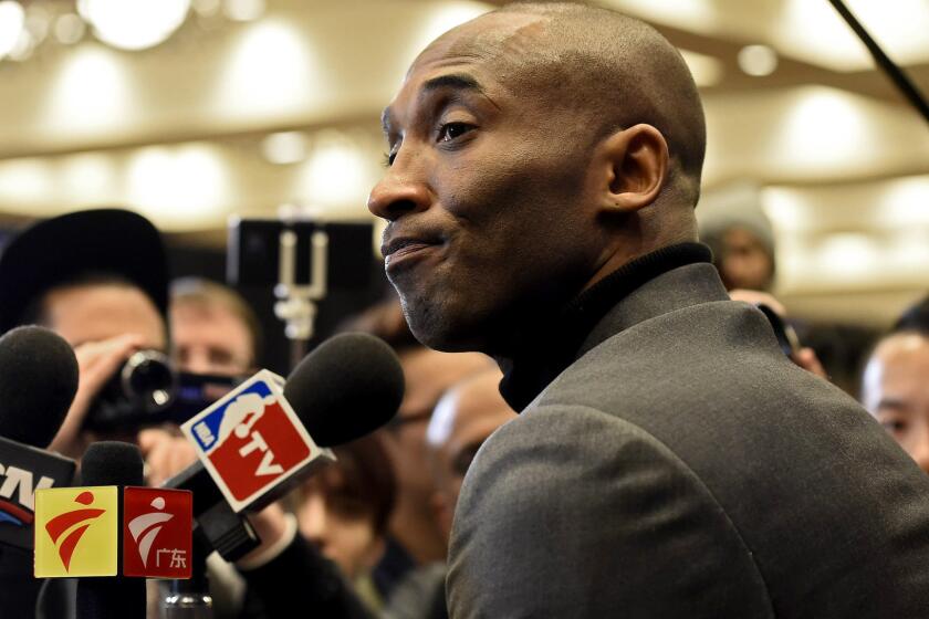 Kobe Bryant listens to a question from a reporter during his media session Friday at NBA All-Star weekend.