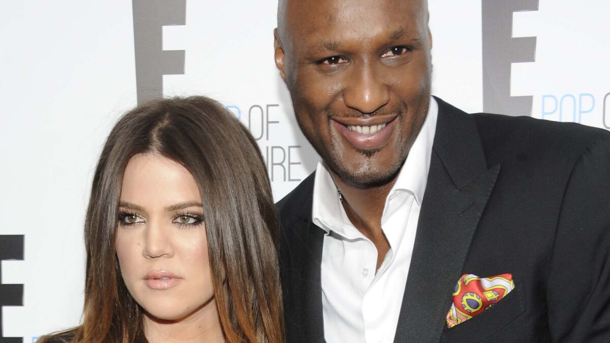 Khloe Kardashian and Lamar Odom, shown in April 2012, have called off their divorce.