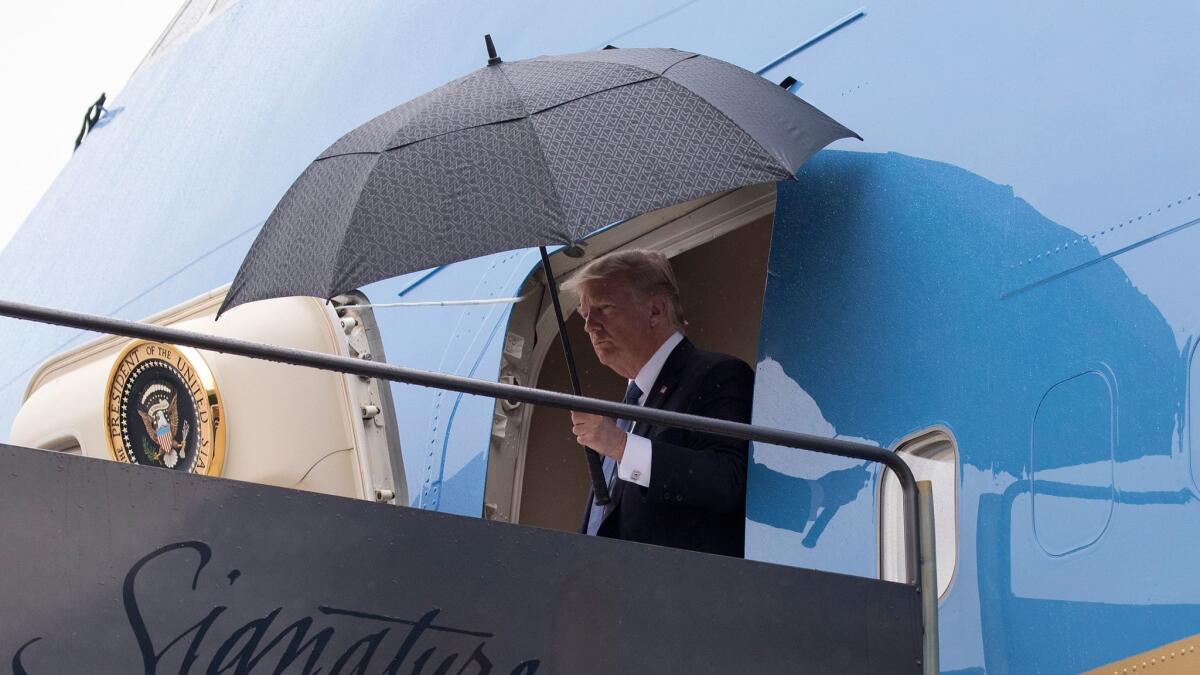 President Donald Trump arrives on Air Force One at Newark Liberty International Airport in Newark N.J., Friday, July 14, 2017, en route to Trump National Golf Club in Bedminster, N.J., as he and first lady Melania Trump returned from France.