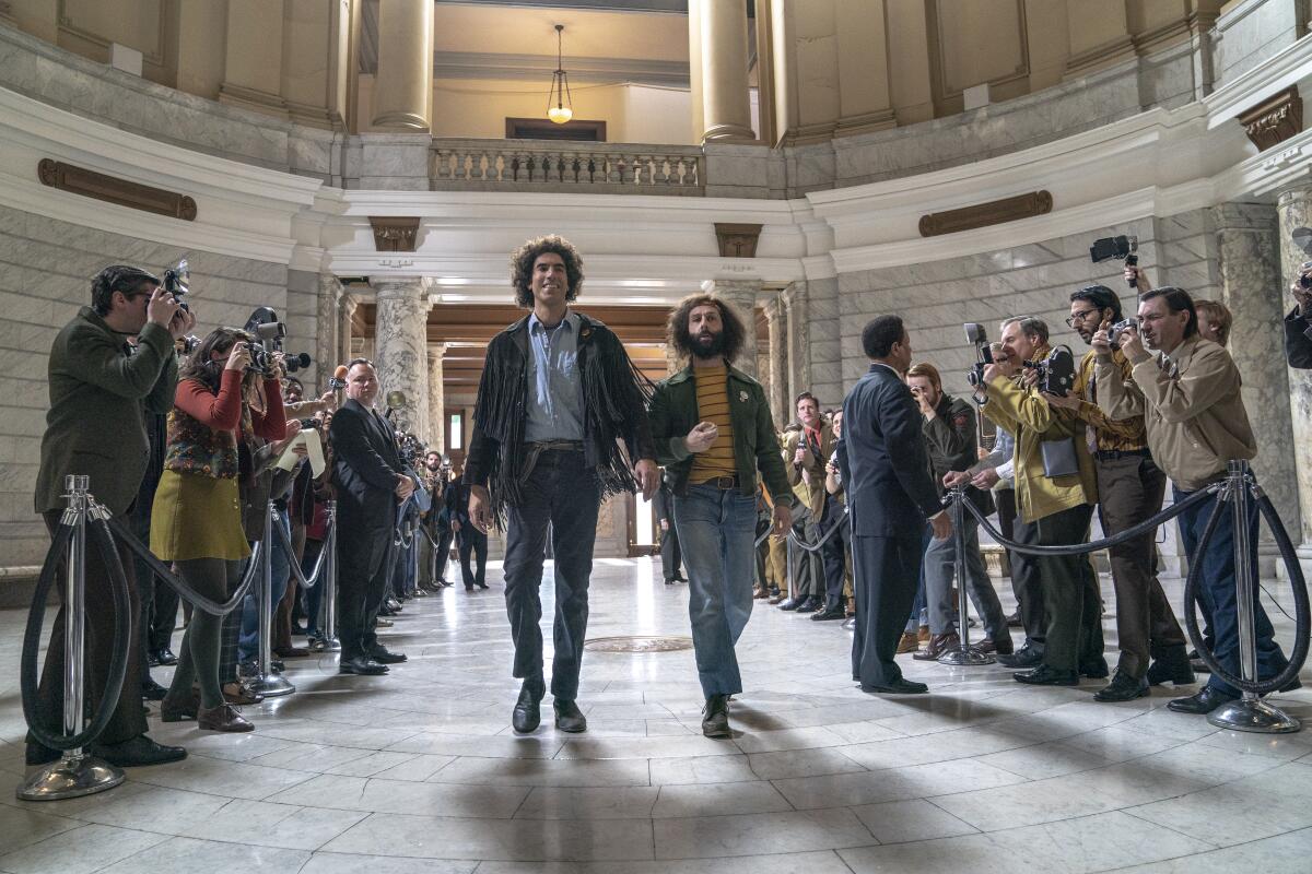 Sacha Baron Cohen and Jeremy Strong in a scene from "The Trial of the Chicago 7."