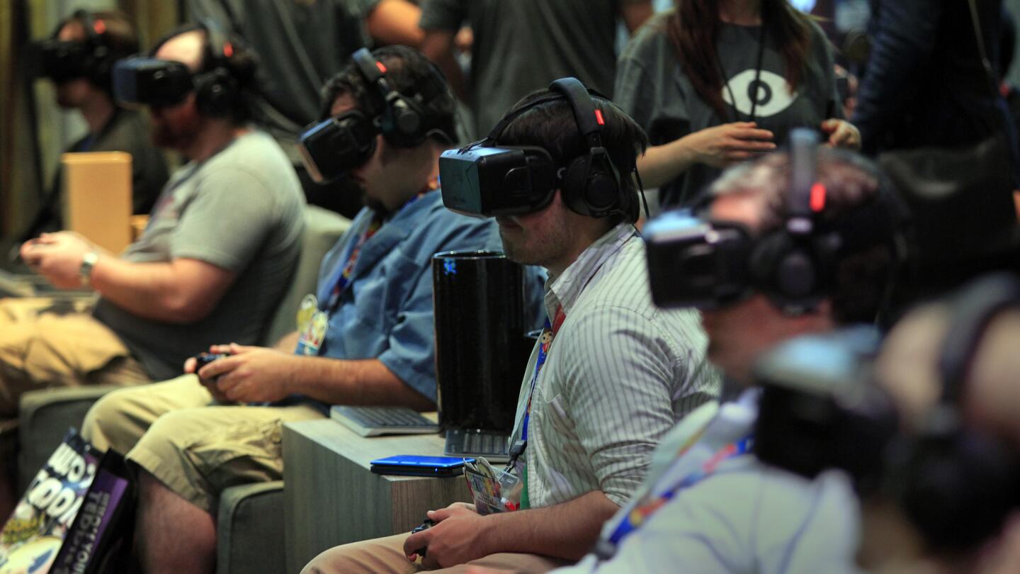 E3, a trade show for computer and video games and related products, was held at the Los Angeles Convention Center this year. Above, visitors try out the Oculus Rift headset, which is billed as the first affordable VR device that won't make users nauseous.