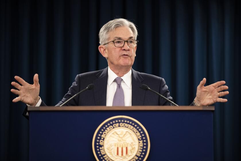 FILE - In this Jan. 29, 2020 file photo Federal Reserve Chair Jerome Powell speaks during a news conference following the Federal Open Market Committee meeting in Washington. The Federal Reserve believes that downside risks to the U.S. economy have lessened with the easing of trade tensions and better prospects for global growth. But officials note a concern that possible spillovers from a deadly virus in China represent a new threat. (AP Photo/Manuel Balce Ceneta, File)