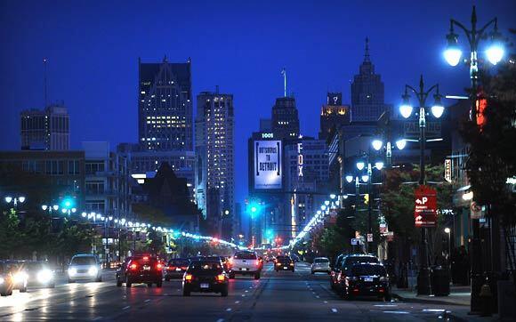 Bright lights, big city: An evening view of downtown Detroit from Woodward Avenue. Think you know the city? Think again. Slip under the radar, and you might be surprised by the secrets you uncover, including a city experiencing a rebirth at the hands of its artists.