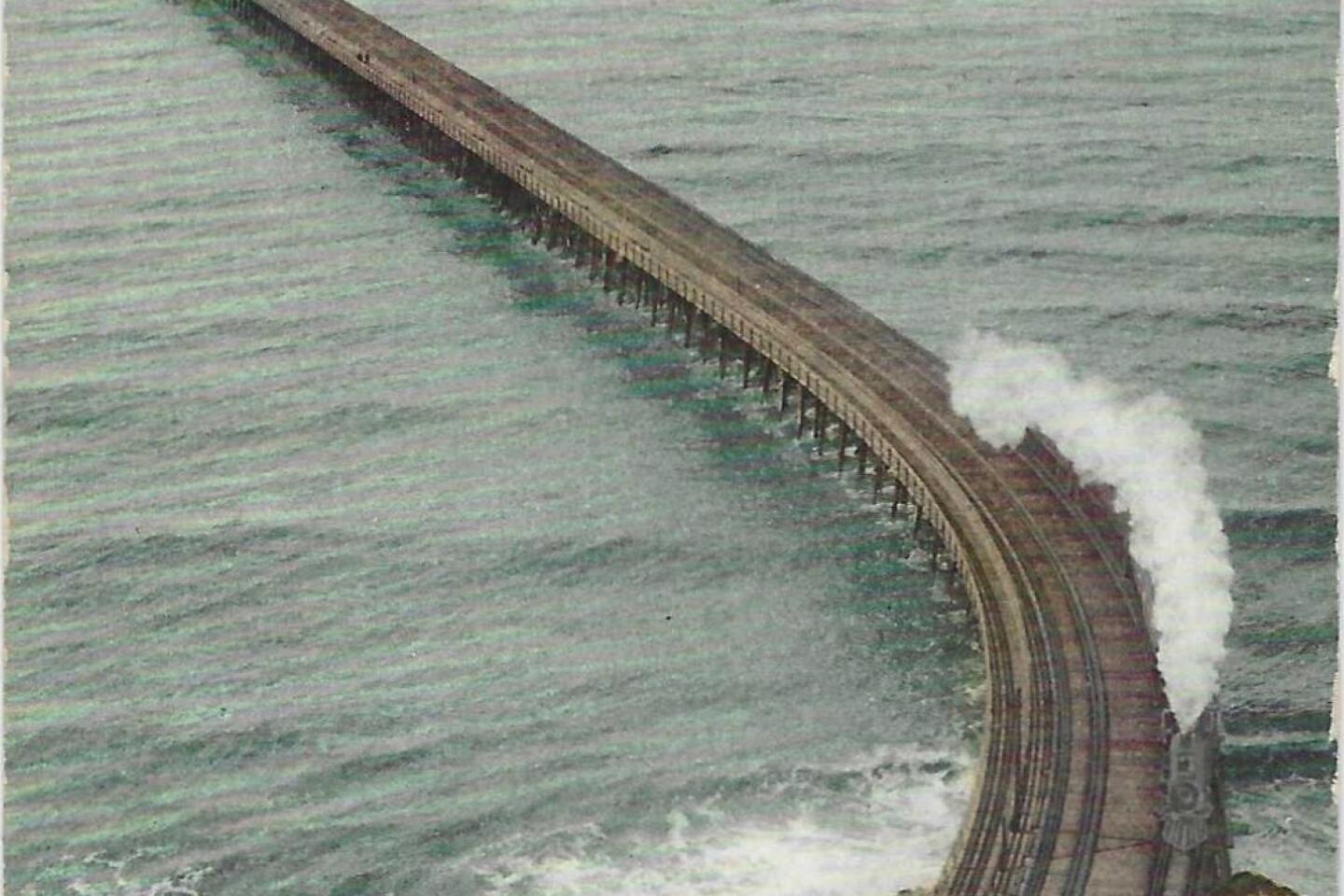 A train navigates the Long Wharf, which snakes out to sea off Santa Monica