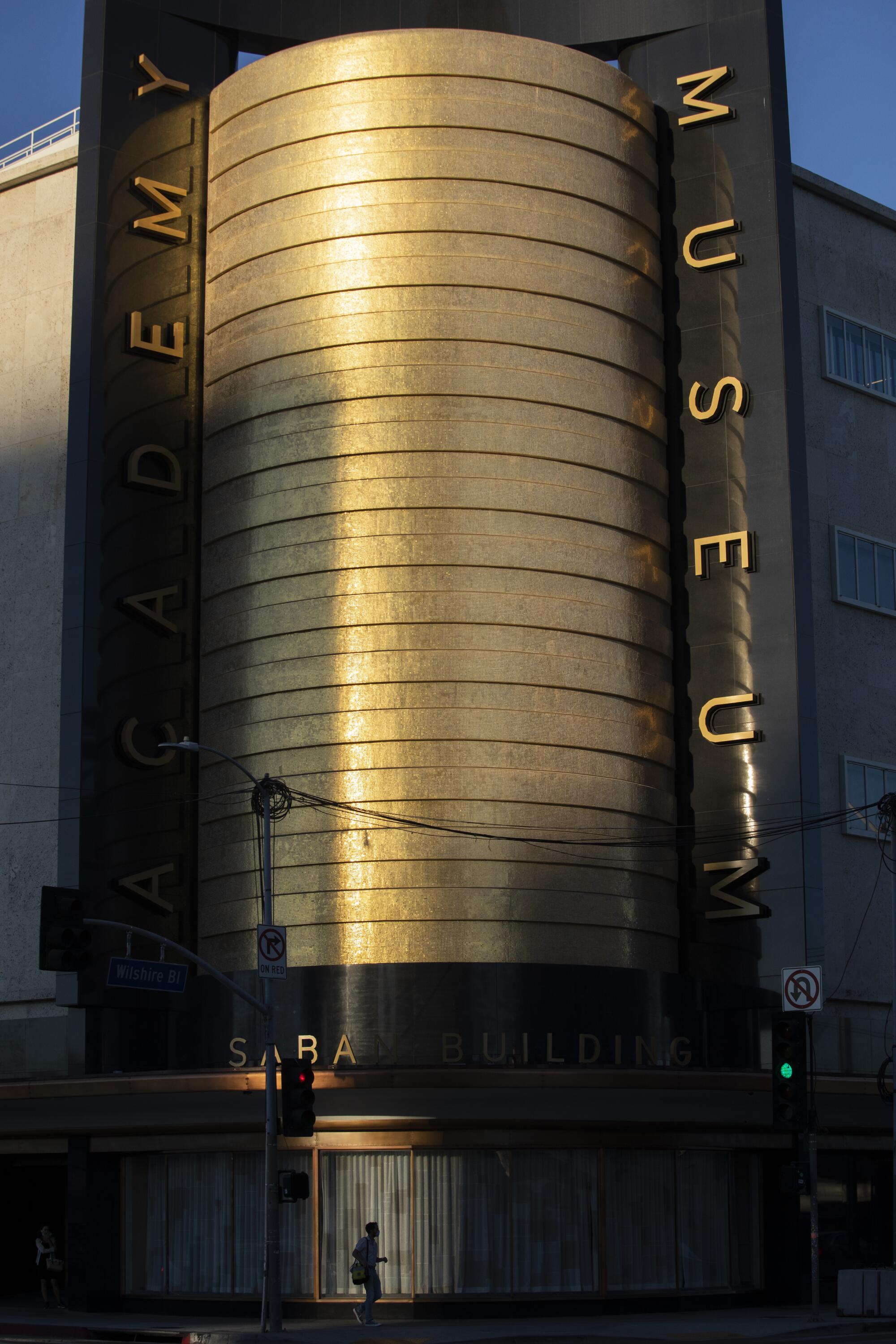 A view of the May Co. building at Wilshire and Fairfax in the afternoon light makes the gold mosaic cylinder shimmer