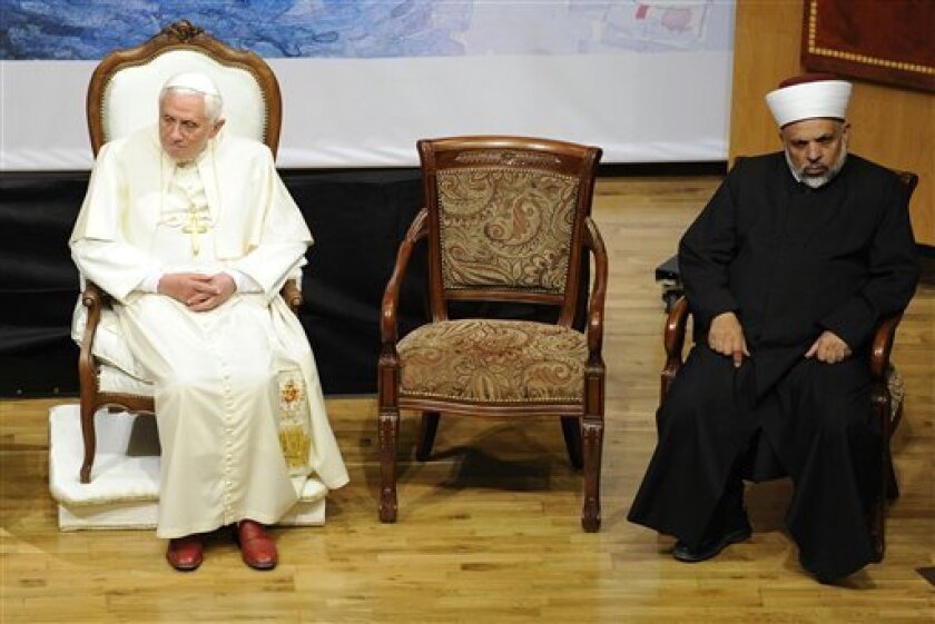 Pope Benedict XVI, left, and Sheikh Taysir Tamimi sit during an interfaith gathering at the Notre Dame Center in Jerusalem, Monday, May 11, 2009. The Pope is on a five day visit to Israel and the Palestinian Territories. (AP Photo/Tony Gentile, pool)