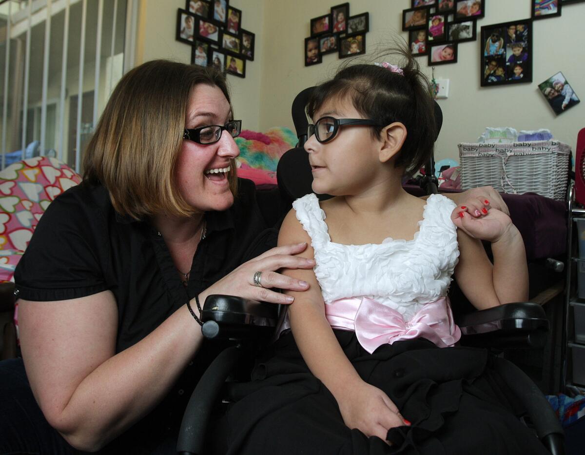 Misty Harlan's and her daughter Novalee Perez, 3, of La Crescenta, in their home on Monday, December 22, 2014. Novalee was born with a rare disease that at 6-months developed into frequent and potentially severe seizures, sometimes as often as 100 times a day. In October, when Novalee was three-and-a-half years old, Misty was approved to administer CBD, a derivative of medical marijuana, that has nearly brought the seizures under control to where they can be considered infrequent. According to Misty, she saw positive changes within 24-hours of giving her the medication.