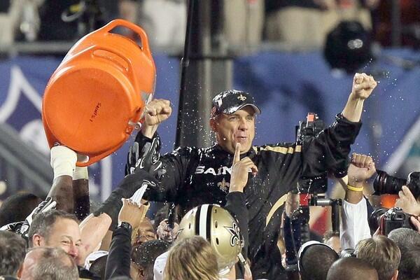 New Orleans Coach Sean Payton, soaked in Gatorade after the obligatory splashing, is hoisted onto his players' shoulders for a postgame victory ride following a 31-17 defeat of the Indianapolis Colts on Sunday in Super Bowl XLIV.