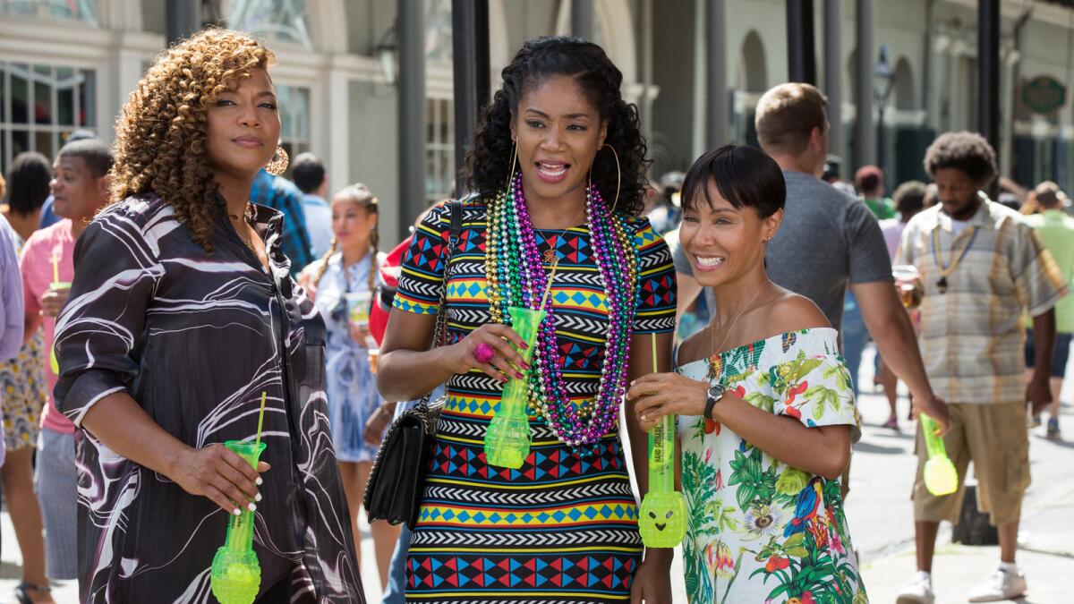 Tiffany Haddish, center, with Queen Latifah, left, and Jada Pinkett Smith, in the film "Girls Trip." (Michele K. Short / Universal Pictures)