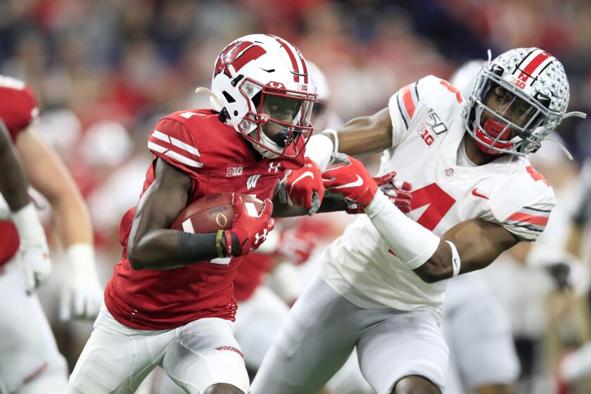 INDIANAPOLIS, INDIANA - DECEMBER 07: Aron Cruickshank #1 of the Wisconsin Badgers runs with the ball against the Ohio State Buckeyes during BIG Ten Football Championship Game2 at Lucas Oil Stadium on December 07, 2019 in Indianapolis, Indiana. (Photo by Andy Lyons/Getty Images)