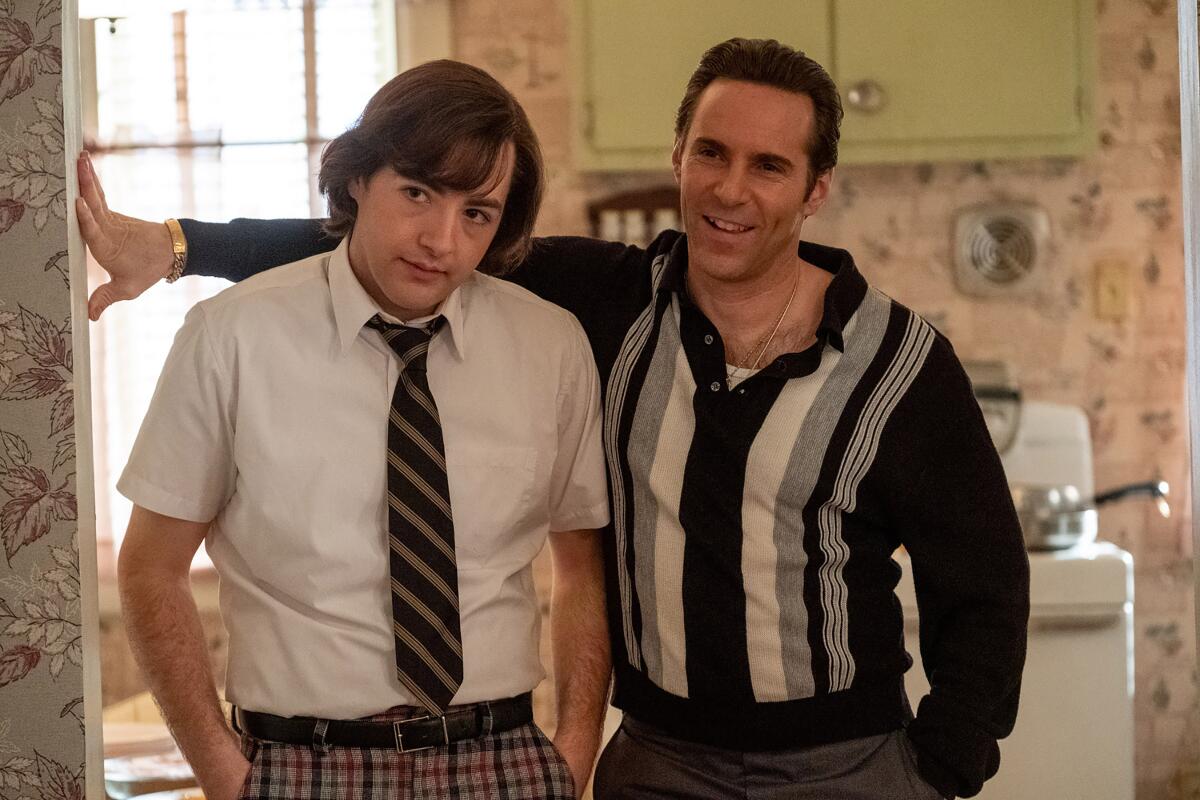 Two young men stand in the doorway of a kitchen in the movie 'The Many Saints of Newark'