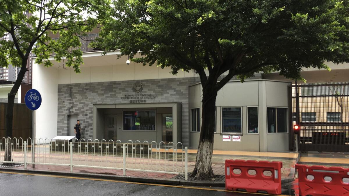 A security person walks outside the U.S. consulate building in Guangzhou in south China's Guangdong province on Thursday.