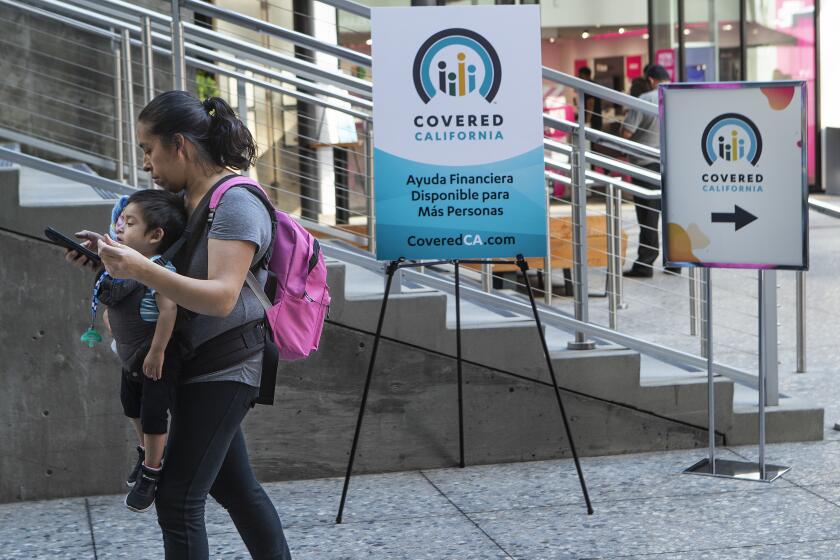 LOS ANGELES, CA-NOVEMBER 4, 2019: Signs promoting Covered California are displayed during a Covered California Open Enrollment Kickoff Event at The Bloc in downtown Los Angeles. The event was held to help raise awareness among Angelenos that part of living a healthy and active lifestyle is to have affordable, quality health coverage. (Mel Melcon/Los Angeles Times)