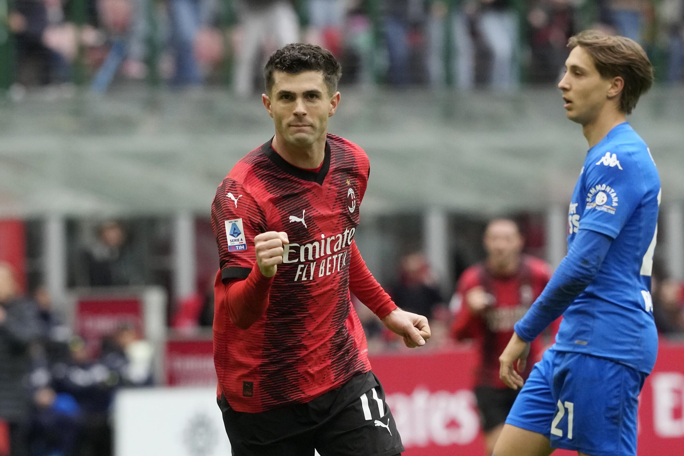 AC Milan's Christian Pulisic celebrates after scoring against Empoli in a Serie A match on March 10.