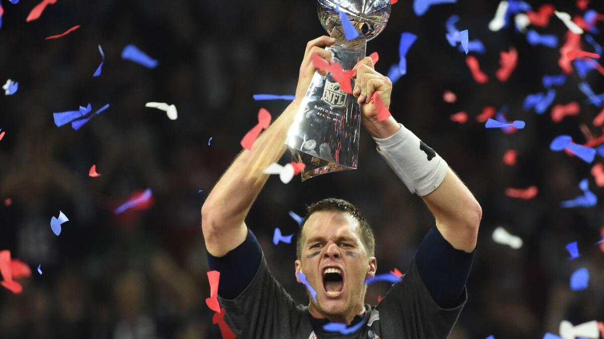 Tom Brady holds the Lombardi Trophy after the New England Patriots beat the Atlanta Falcons at Super Bowl LI.