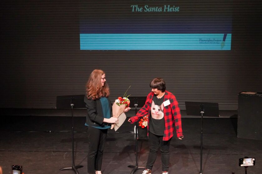 Cecelia Kouma of Playwrights Project, left, and "Santa Heist" playwright Ell Banoub, 12.