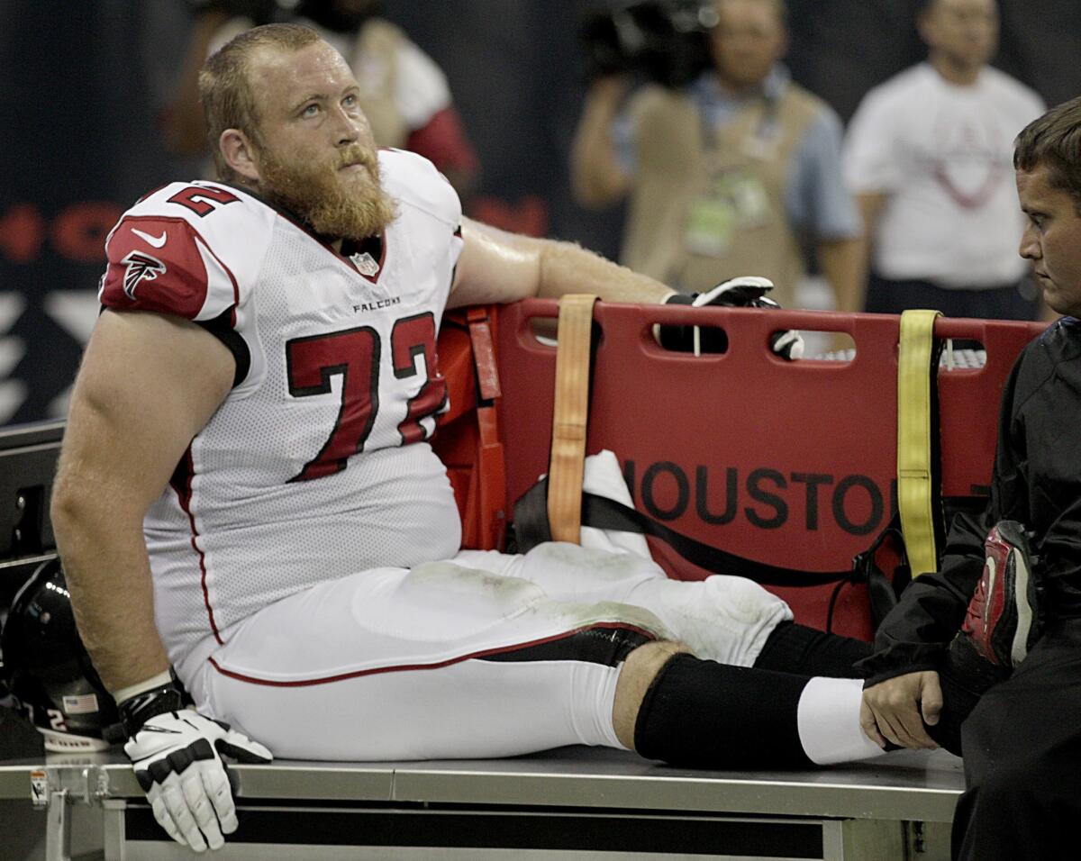 Atlanta's Sam Baker is carted off the field after hurting his knee against the Houston Texans on Aug. 16.