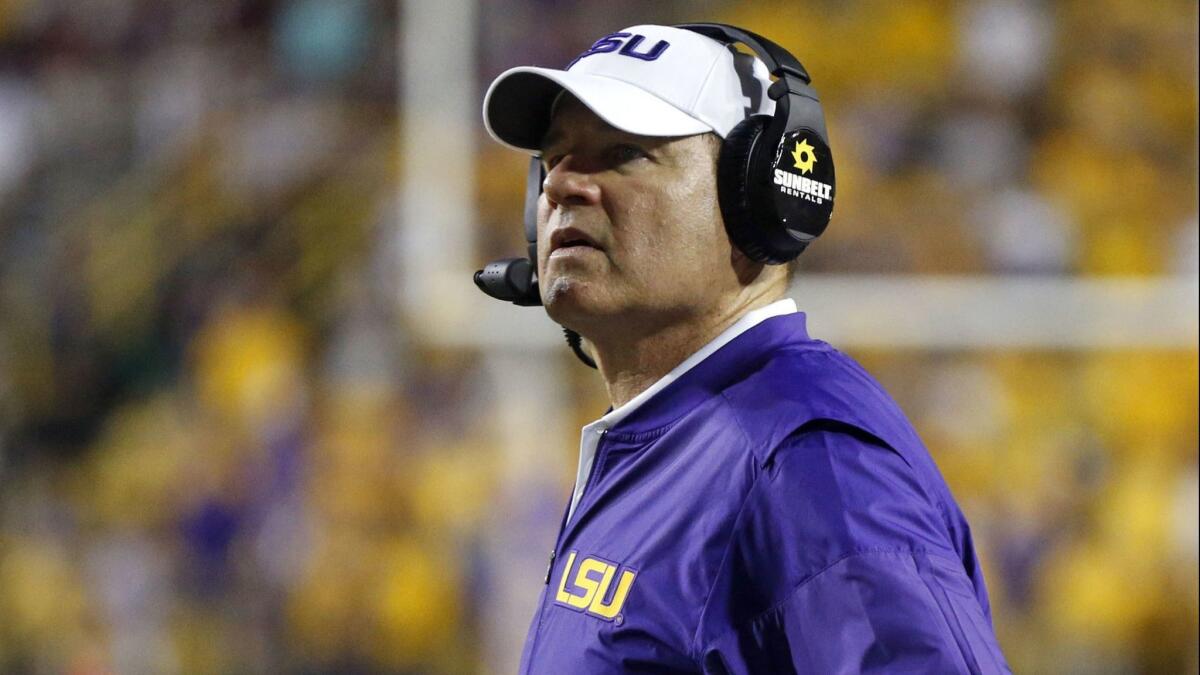 Former LSU coach Les Miles has been hired to lead Kansas' downtrodden football program. Miles spent 11 years at LSU, winning a national championship in 2007, before being fired four games into the 2016 season.