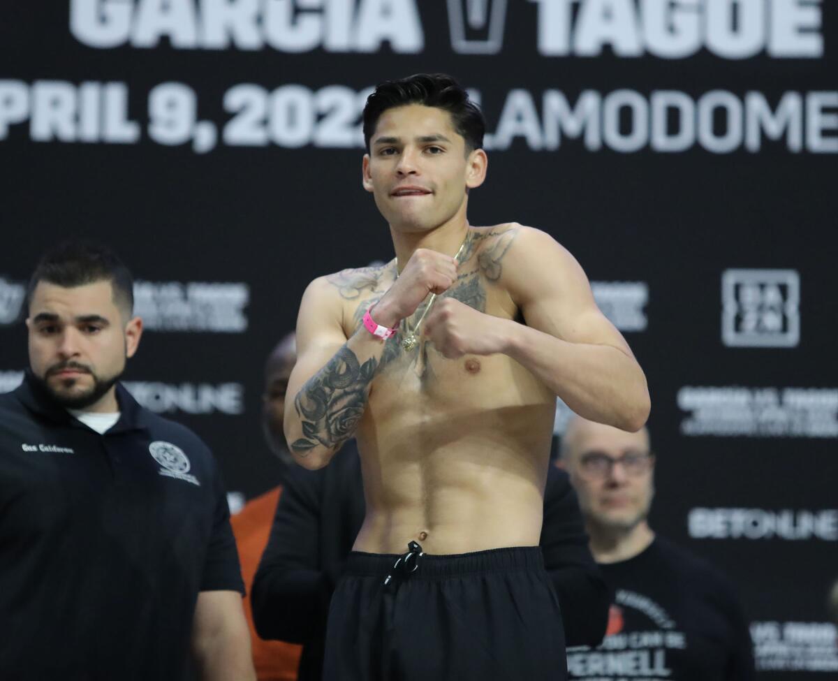 Ryan Garcia poses in front of media during his weigh-in Friday in Los Angeles.