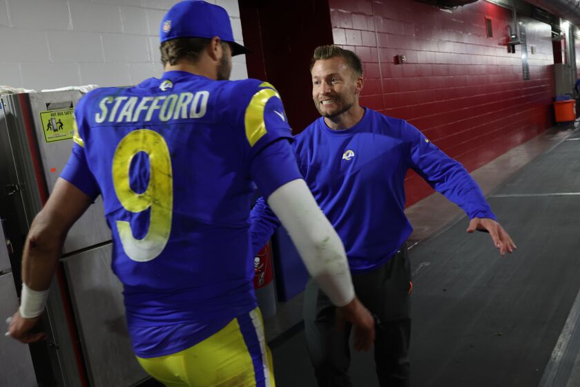 Tampa, Florida, Sunday, January 23, 2022 - Los Angeles Rams head coach Sean McVay rushes to hug quarterback Matthew Stafford on his way to the locker room after beating the Tampa Bay Buccaneers 30-27 in the NFC Divisional Playoff at Raymond James Stadium. (Robert Gauthier/Los Angeles Times)