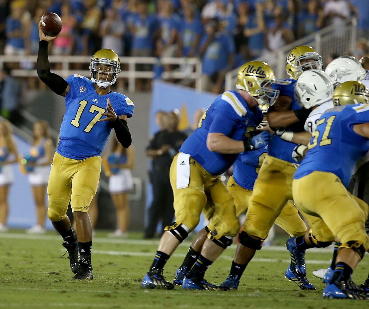 UCLA quarterback Brett Hundley has plenty of time to pass as his offensive line protects him during the Bruins' season-opening win against Nevada. An offensive line renaissance appears to be underway in Westwood.