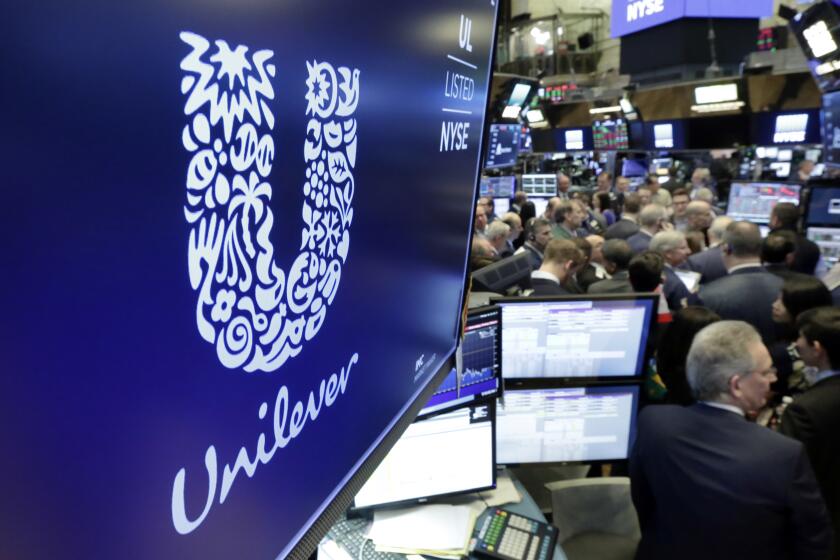 FILE - In this Thursday, March 15, 2018 file photo, the logo for Unilever appears above a trading post on the floor of the New York Stock Exchange. Unilever says it raised prices by more than 11% between April and June as inflation surged. The consumer goods giant said Tuesday, July 26, 2022, that underlying sales growth of 8.1% in the first half of the year was driven by rising prices to offset the higher costs it paid to create everything from Ben & Jerry’s ice cream to Dove skin care. It brought in revenue of $30 billion in the first half of 2022. .(AP Photo/Richard Drew, File)