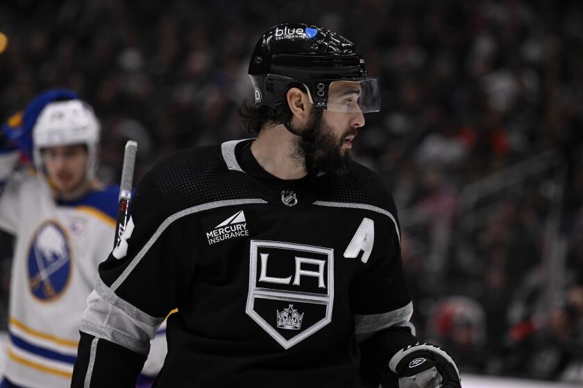 Los Angeles Kings defenseman Drew Doughty ooks over his shoulder during the third period of an NHL hockey game against the Buffalo Sabres in Los Angeles, Wednesday, Jan. 24, 2024. (AP Photo/Alex Gallardo)