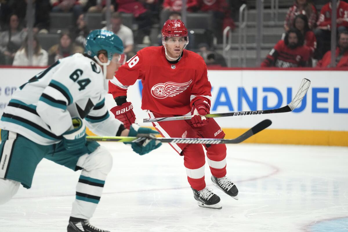 Patrick Kane returns, just misses a shot in season debut with Red Wings in  6-5 OT loss to Sharks - The San Diego Union-Tribune