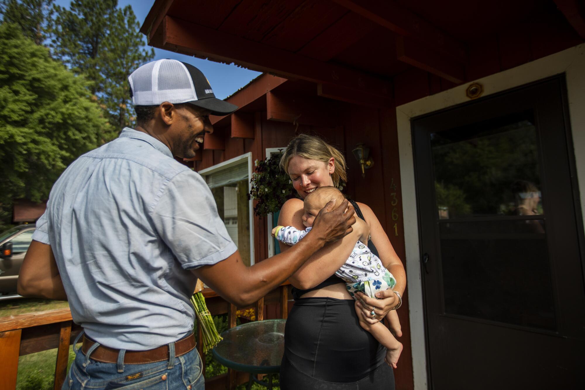 Andre Essue delivers fresh flowers from the back of his vehicle in Taylorsville. 