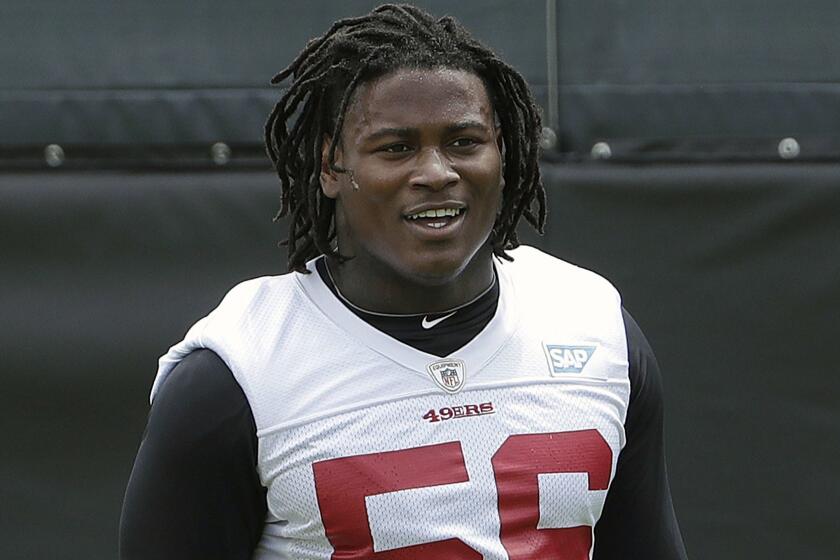 FILE - In this May 30, 2018, file photo, San Francisco 49ers linebacker Reuben Foster walks on the field during a practice at the team's NFL football training facility in Santa Clara, Calif. Foster was arrested Saturday, Nov. 24, at the team hotel on charges of domestic violence. (AP Photo/Jeff Chiu, File)