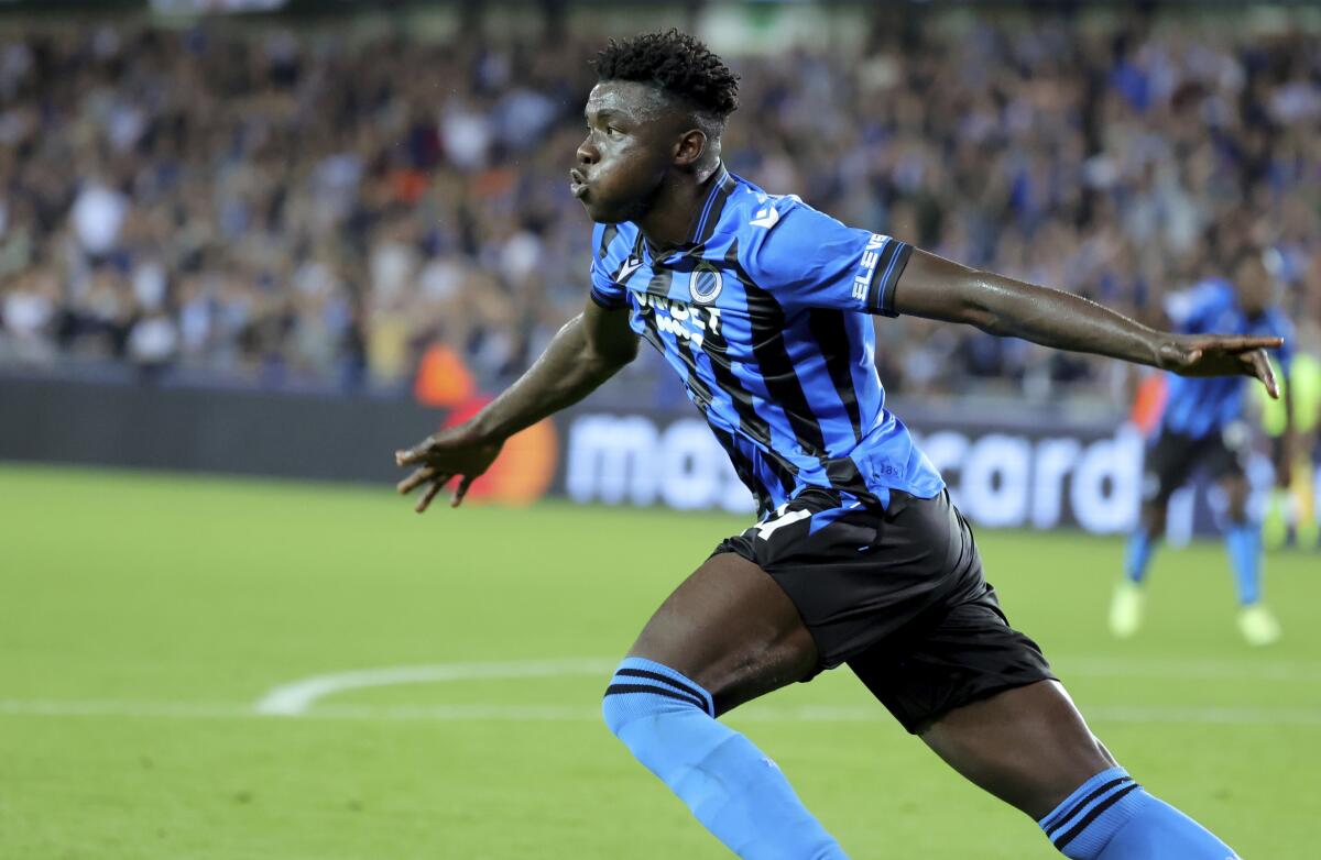 Brugge's Abakar Sylla jubilates after scoring the opening goal of the match during the Champions League Group B soccer match between Club Brugge and Leverkusen at the Jan Breydel stadium in Bruges, Belgium, Wednesday, Sept. 7, 2022. (AP Photo/Olivier Matthys)