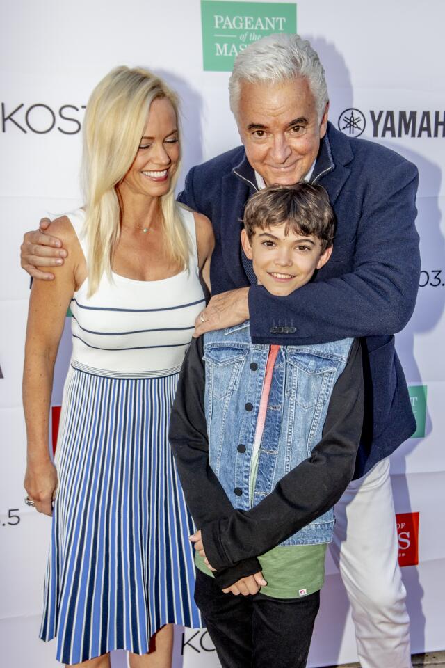 Lisa, John (TV's "Seinfeld and "Family Fued") and Will O'Hurley pose for photos on the red carpet of the Celebrity Benefit at Festival of Arts and Pageant of the Masters on Saturday in Laguna Beach.